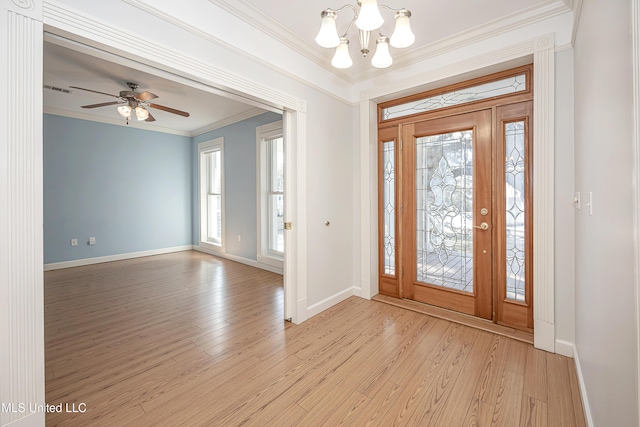 entryway with light wood-type flooring, crown molding, baseboards, and ceiling fan with notable chandelier