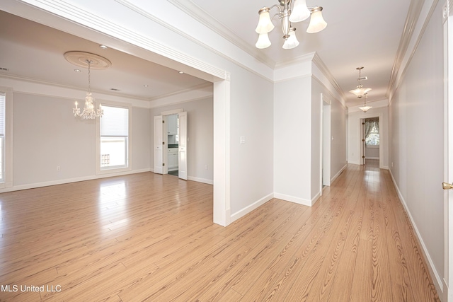 interior space featuring a chandelier, light wood-style floors, and plenty of natural light