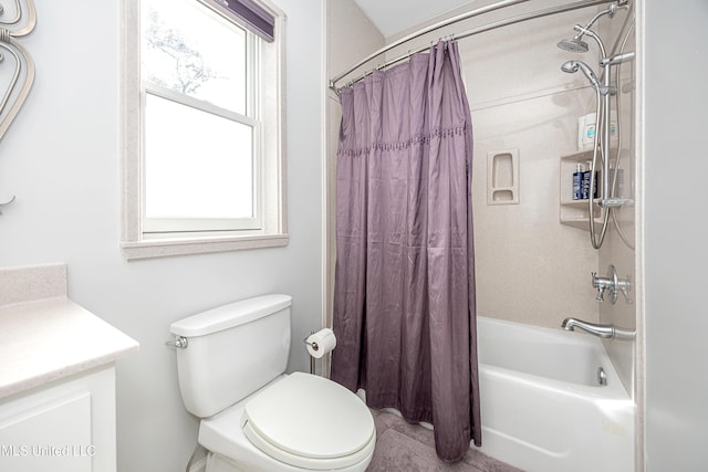 bathroom with vanity, toilet, and shower / bath combo with shower curtain