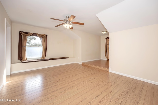 additional living space featuring light wood-style floors, ceiling fan, and baseboards