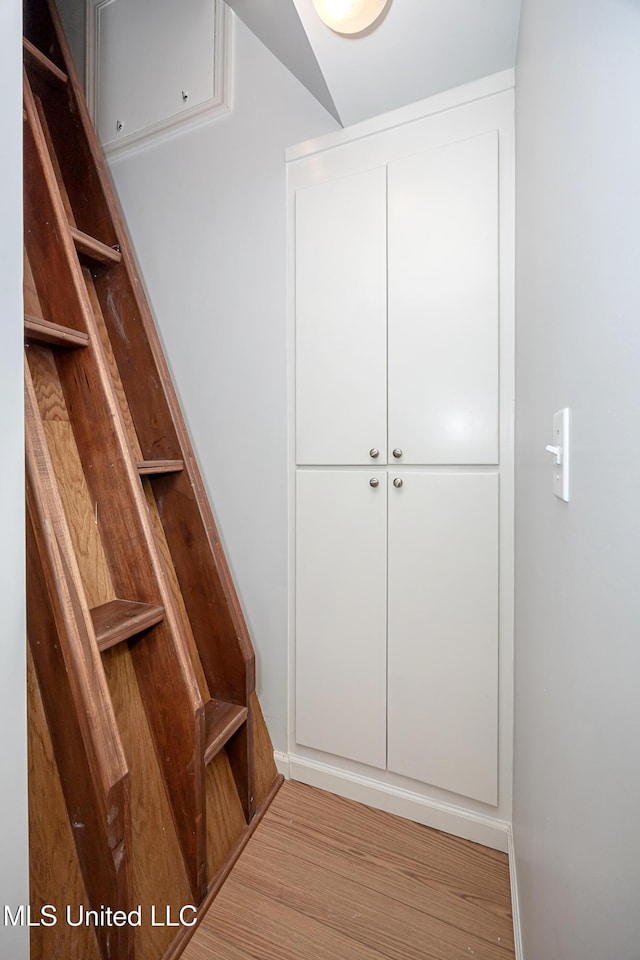 mudroom with wood finished floors