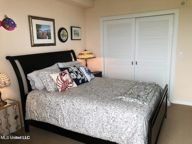bedroom featuring a closet, carpet flooring, and baseboards