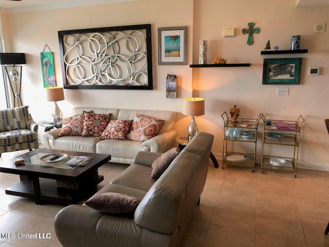 tiled living area with baseboards