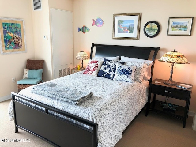 bedroom with visible vents, baseboards, and carpet floors