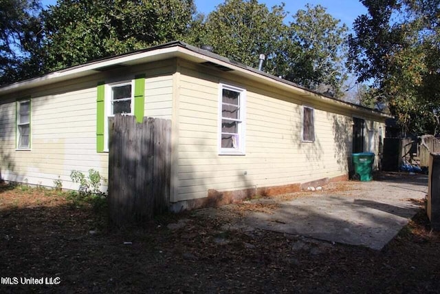 view of side of property featuring a patio area