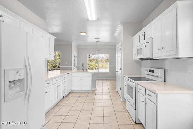 kitchen featuring kitchen peninsula, white appliances, white cabinets, and sink