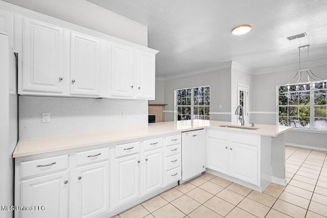 kitchen featuring kitchen peninsula, sink, white cabinets, and white appliances