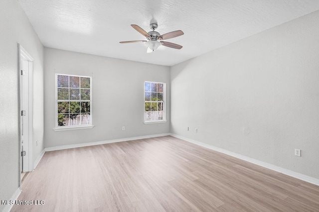 unfurnished room with light hardwood / wood-style flooring and ceiling fan