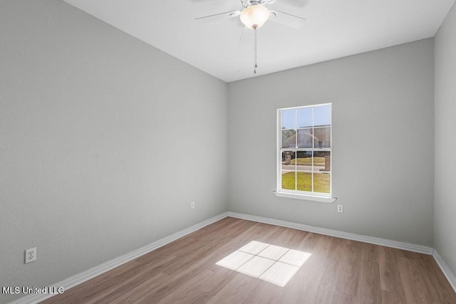 spare room with ceiling fan and light hardwood / wood-style floors