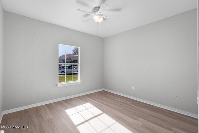 unfurnished room with light wood-type flooring and ceiling fan