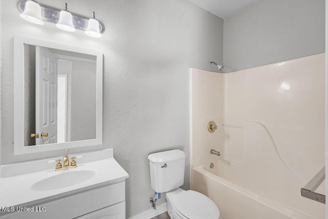 full bathroom featuring vanity, shower / bathtub combination, and toilet