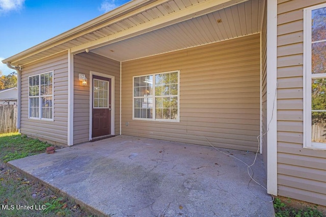 property entrance featuring a patio area