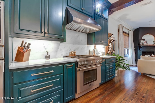 kitchen featuring tasteful backsplash, visible vents, under cabinet range hood, light countertops, and high end stainless steel range oven