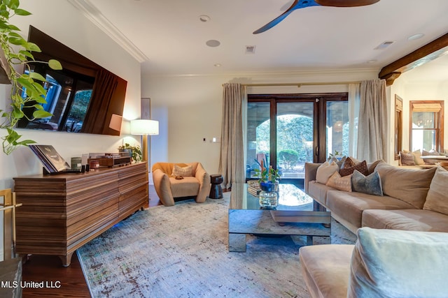 living area featuring a ceiling fan, crown molding, wood finished floors, and visible vents