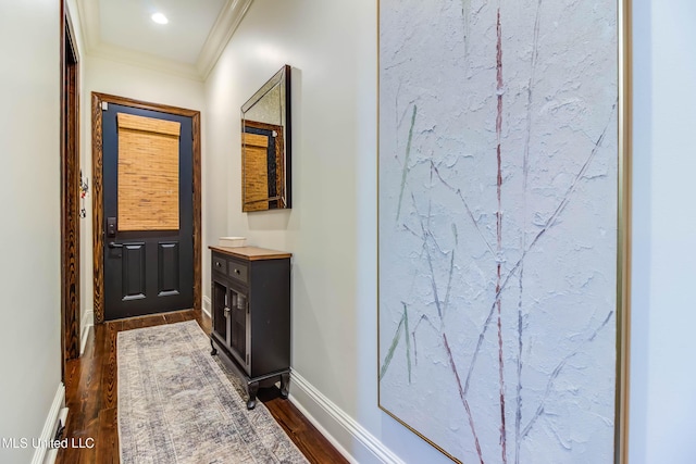 bathroom with ornamental molding, vanity, baseboards, and wood finished floors