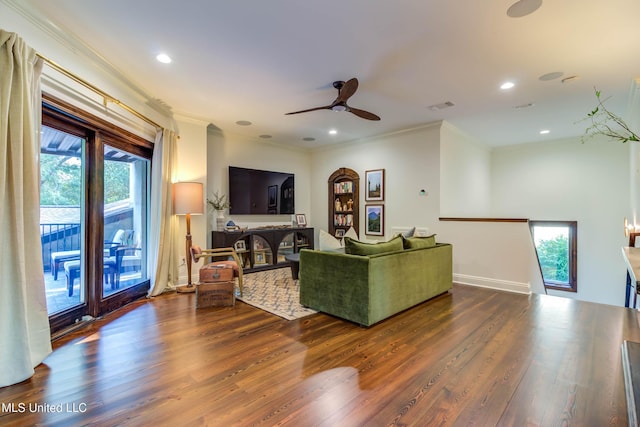 living area featuring crown molding, recessed lighting, wood finished floors, and visible vents