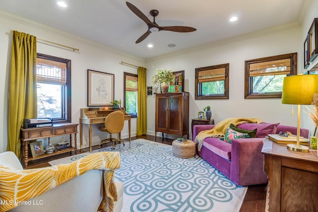 living room with a healthy amount of sunlight, crown molding, and wood finished floors