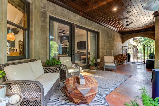 view of patio with an outdoor hangout area, a gate, and ceiling fan