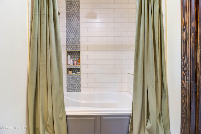 bathroom with shower / tub combo