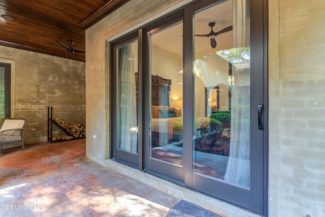 doorway to property featuring brick siding