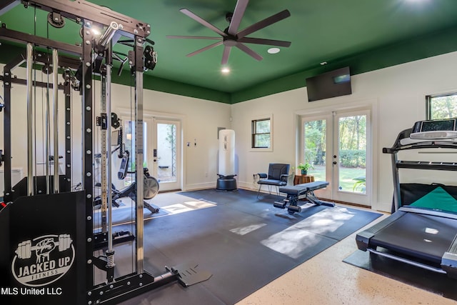 workout area featuring french doors, baseboards, and ceiling fan