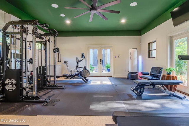 gym with a ceiling fan, recessed lighting, and french doors