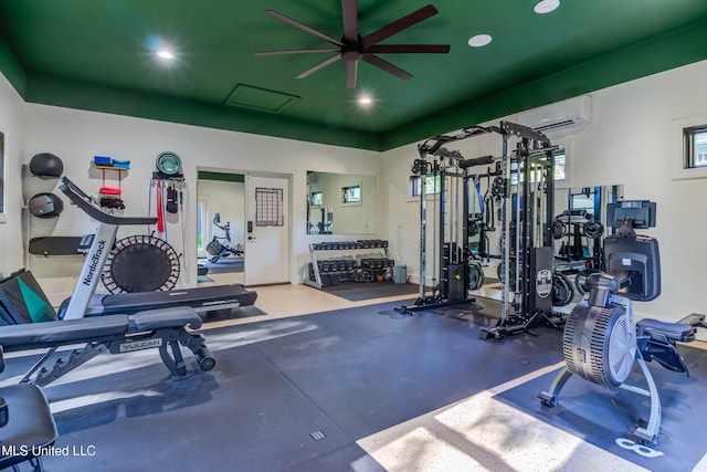 workout area featuring a wall unit AC, recessed lighting, and a ceiling fan