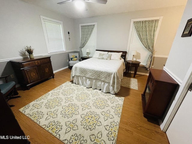 6324 Country Ln, Moss Point, MS 39562 - bedroom with wood finished floors, baseboards, and ceiling fan
