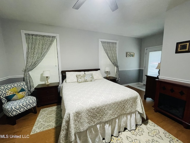 6324 Country Ln, Moss Point, MS 39562 - bedroom with multiple windows, wood finished floors, baseboards, and ceiling fan