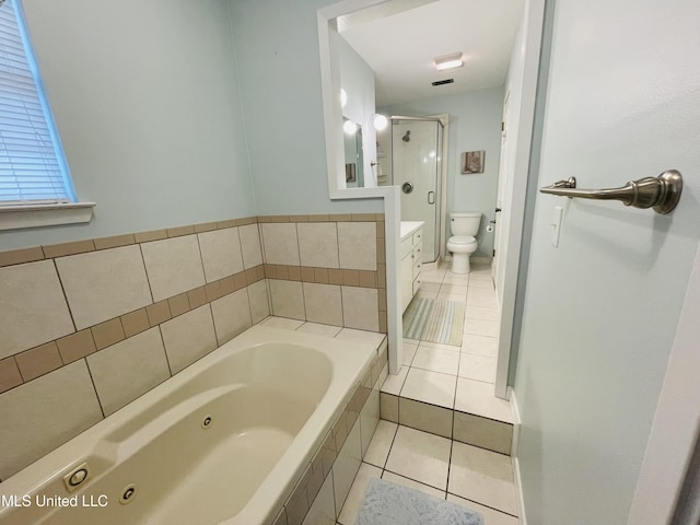 6324 Country Ln, Moss Point, MS 39562 - bathroom with tile patterned flooring, toilet, a jetted tub, vanity, and a stall shower