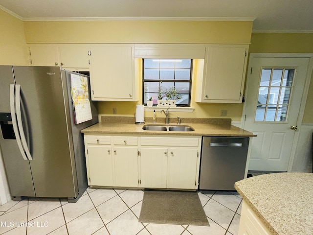 6324 Country Ln, Moss Point, MS 39562 - kitchen featuring appliances with stainless steel finishes, a sink, light tile patterned flooring, light countertops, and ornamental molding