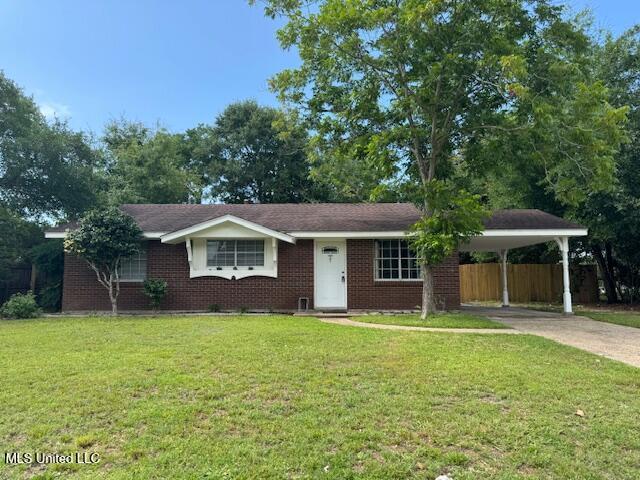 2610 Demaret Dr, Gulfport, MS 39507 - ranch-style house with driveway, brick siding, and a carport