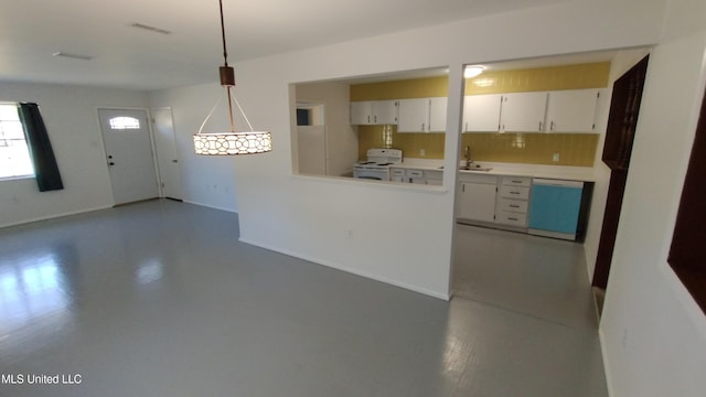 2610 Demaret Dr, Gulfport, MS 39507 - kitchen with white range, dishwasher, white cabinets, light countertops, and a sink