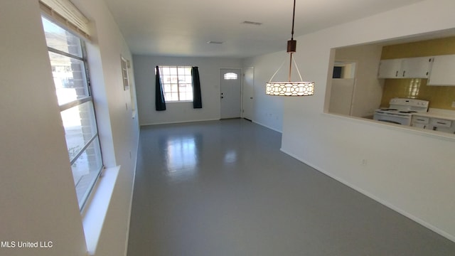 2610 Demaret Dr, Gulfport, MS 39507 - unfurnished dining area featuring finished concrete floors and baseboards