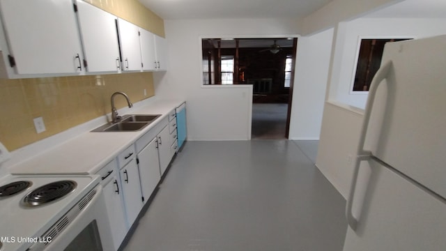 2610 Demaret Dr, Gulfport, MS 39507 - kitchen with white appliances, a sink, ceiling fan, light countertops, and decorative backsplash