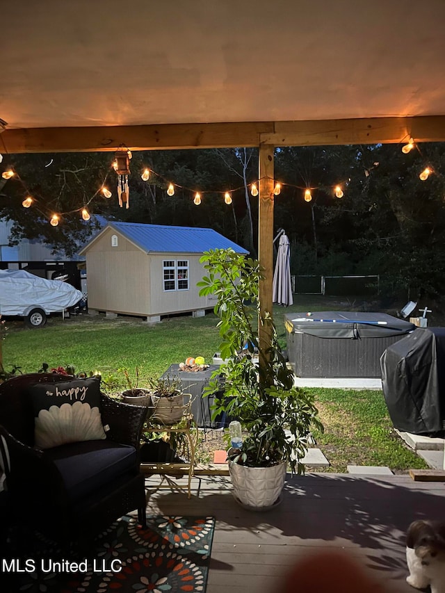 view of patio / terrace with area for grilling and an outdoor structure