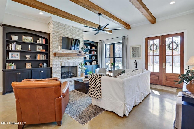 living room featuring finished concrete floors, french doors, a fireplace, and beamed ceiling