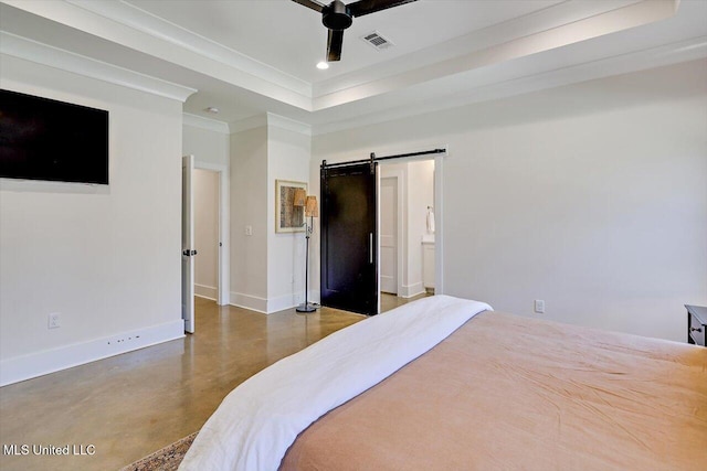 bedroom with a barn door, visible vents, baseboards, finished concrete floors, and a tray ceiling