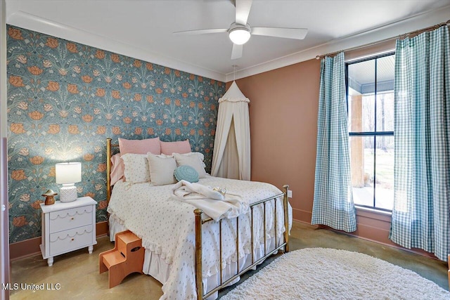 bedroom with baseboards, crown molding, a ceiling fan, and wallpapered walls