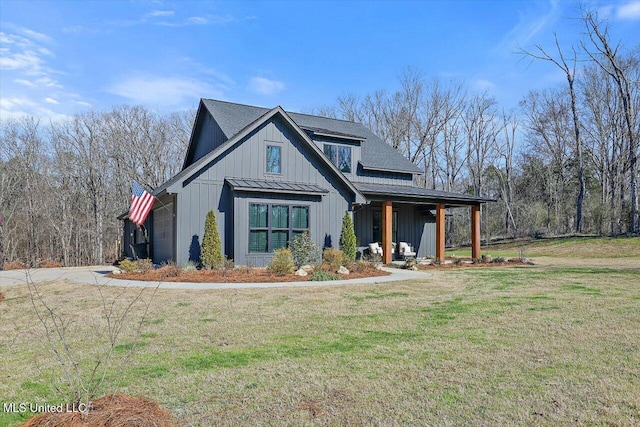 modern farmhouse style home featuring metal roof, roof with shingles, a standing seam roof, a front lawn, and board and batten siding