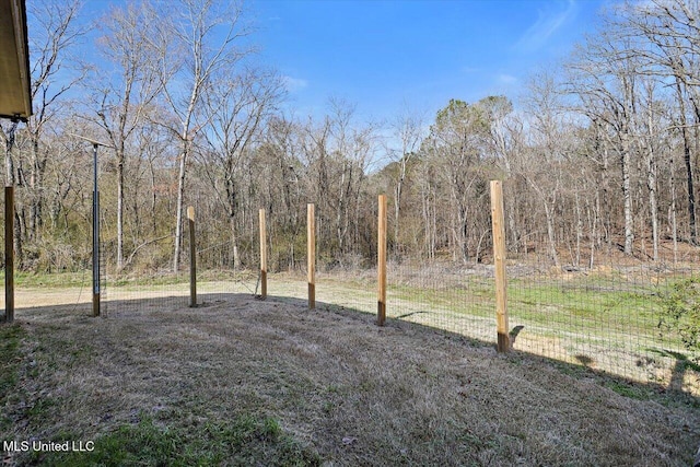 view of yard with a wooded view