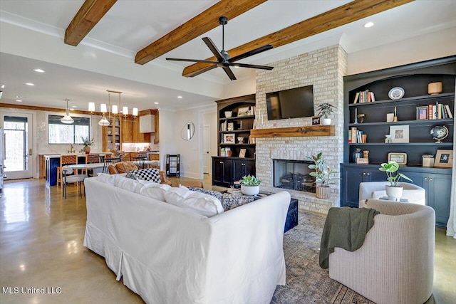 living area with built in features, recessed lighting, beam ceiling, and a fireplace