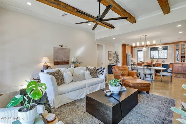 living room featuring beam ceiling, crown molding, recessed lighting, visible vents, and ceiling fan