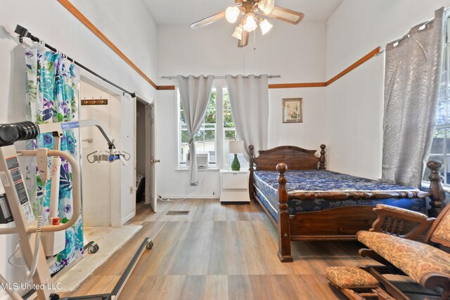 3902 Pascagoula St, Pascagoula, MS 39567 - bedroom with a towering ceiling, multiple windows, and wood finished floors
