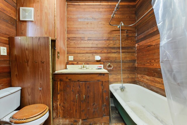 3902 Pascagoula St, Pascagoula, MS 39567 - full bath with wood walls, toilet, shower / bath combination with curtain, and vanity