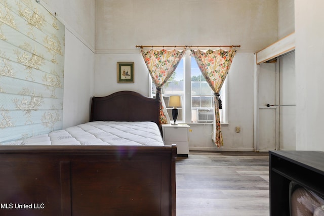 3902 Pascagoula St, Pascagoula, MS 39567 - bedroom featuring wood finished floors, baseboards, and wallpapered walls