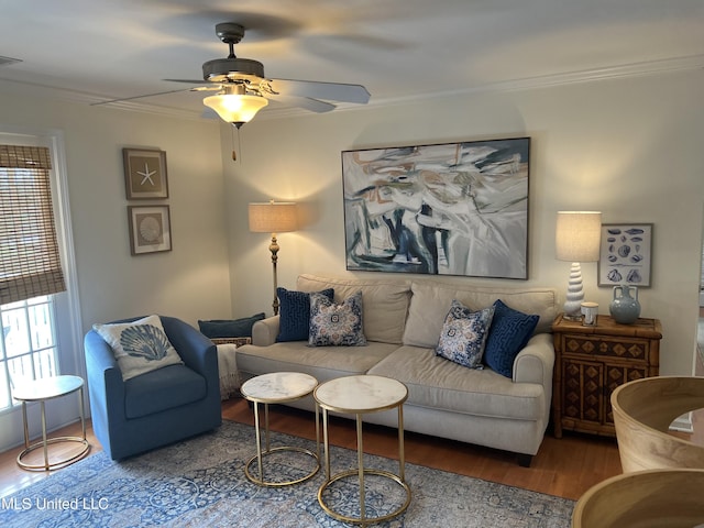 living room with hardwood / wood-style flooring, ornamental molding, plenty of natural light, and ceiling fan