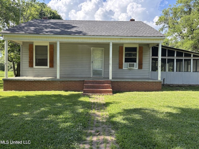 232 Renfroe Rd, Canton, MS 39046 - view of front of house featuring roof with shingles, a chimney, a front lawn, and a porch