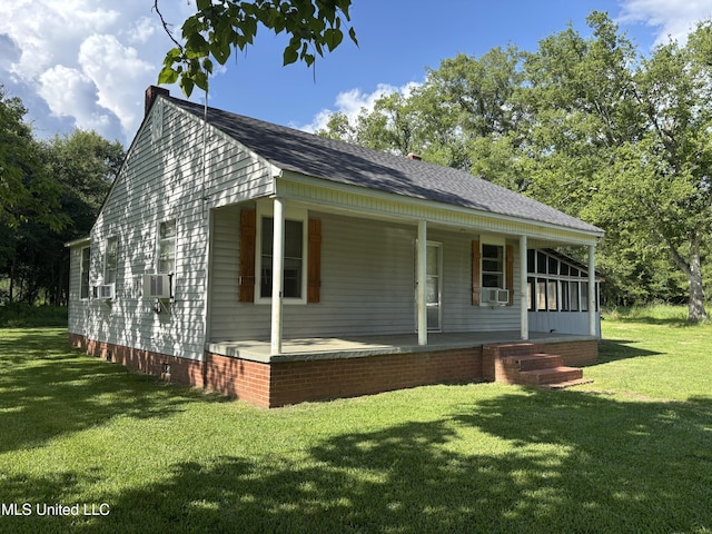232 Renfroe Rd, Canton, MS 39046 - view of front of property featuring covered porch, a front lawn, and cooling unit