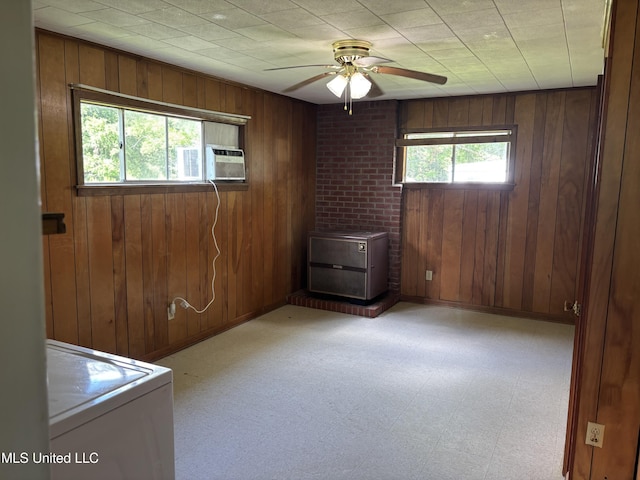 232 Renfroe Rd, Canton, MS 39046 - empty room with washer / dryer, wooden walls, ceiling fan, light flooring, and cooling unit